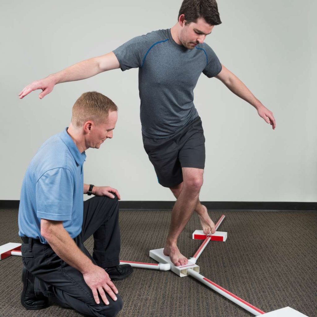 a man doing a functional movement screening test at Capstone Physical Therapy and Fitness